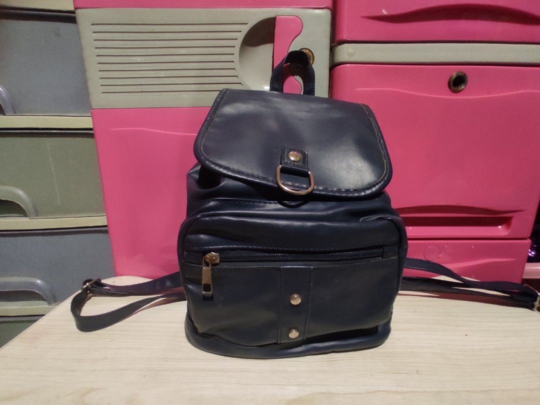 Navy Blue Parisian Faux Leather Mini Backpack (Category: Backpacks) located in Manila. Submitted by xiaochao.16 (Listing ID 1463739100, Image 2). Description: - Cute navy blue mini backpack - Faux leather material - Front zip pocket - Main compartment - Adjustable straps - Brand: Parisian - Ideal for everyday use or travel.