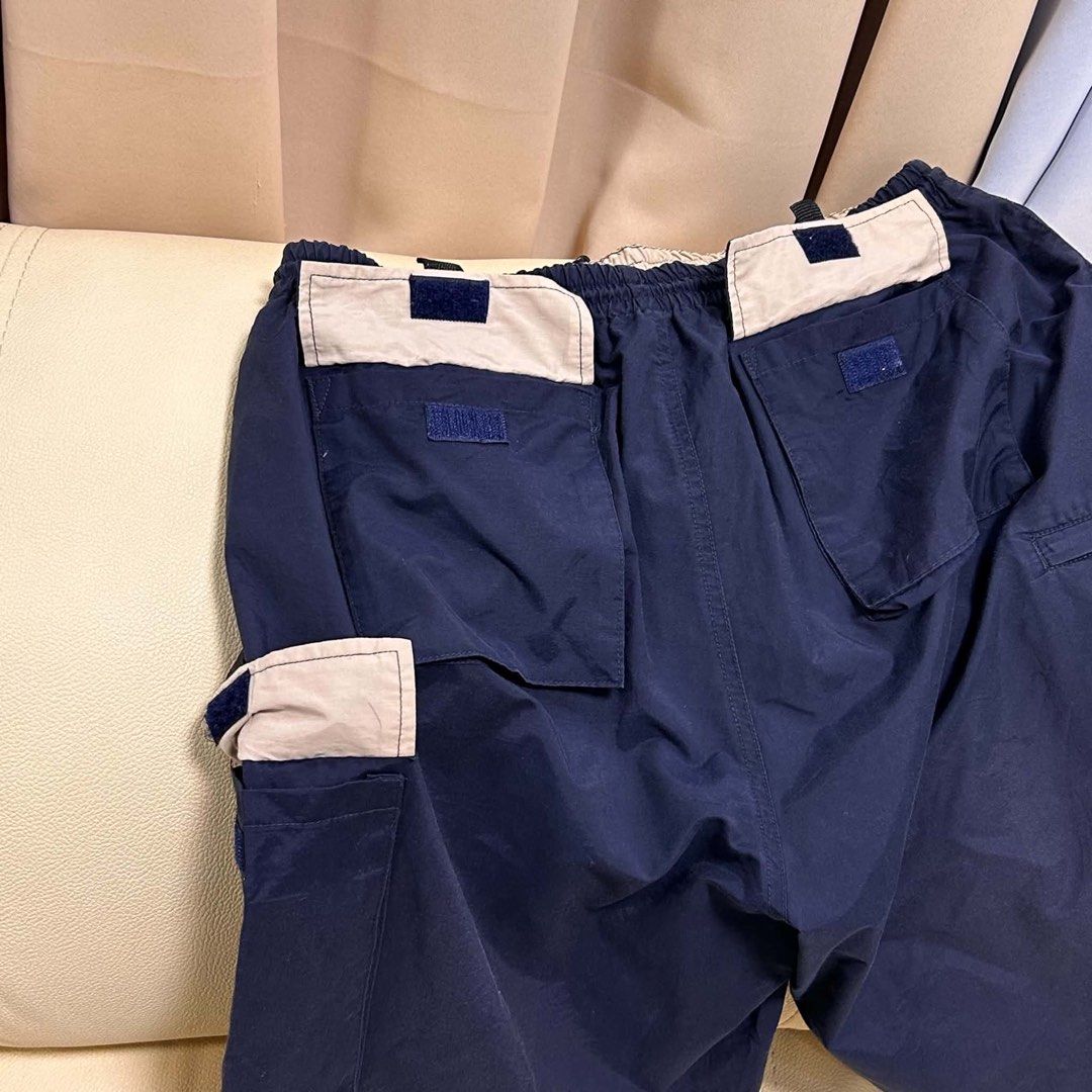 Navy Blue Polo Ralph Lauren Cargo Shorts (Category: Shorts) located in Manila. Submitted by bud_thriftt (Listing ID 1463673416, Image 3). Description: - Brand: Polo Ralph Lauren - Color: Navy Blue - Style: Cargo Shorts - Features: Elastic waistband with drawstring, multiple pockets with velcro closures - Detail: Small pink pony logo on left leg - Ideal for: Casual wear, sports.