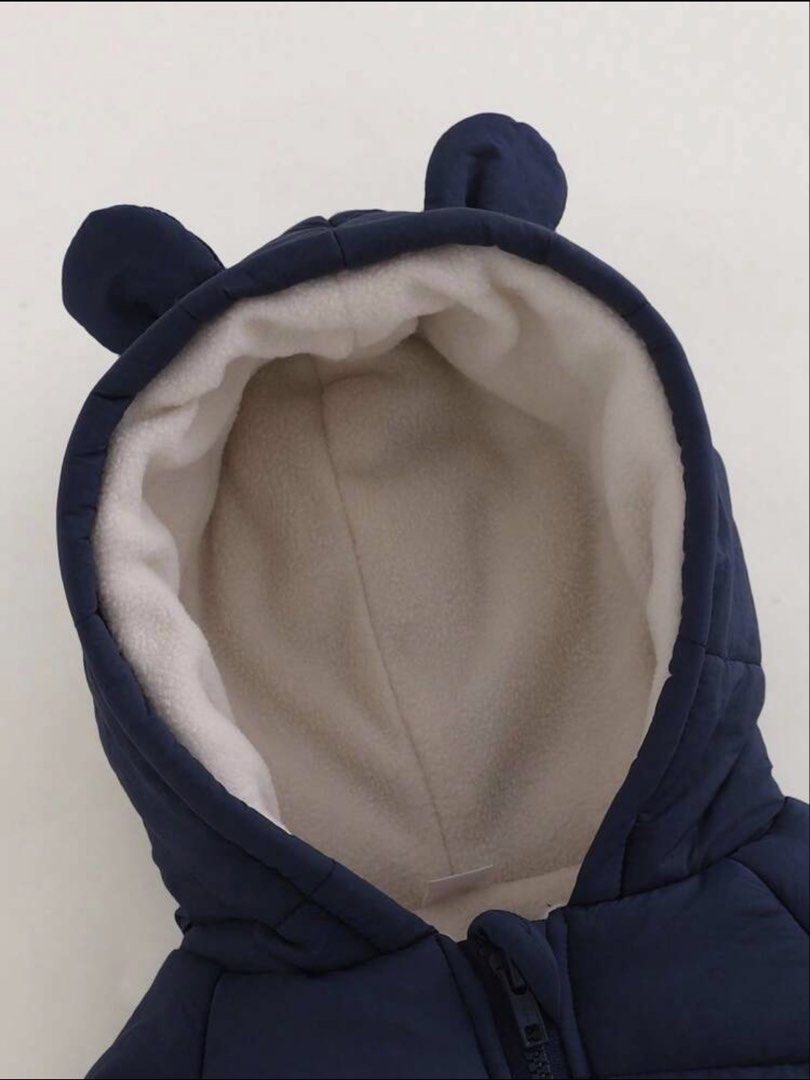 Navy Blue Puffer Jacket with Bear Ears Hood (Category: Babies & Kids Fashion) located in Quezon City. Submitted by issawoah (Listing ID 1463602656, Image 2). Description: - Adorable navy blue puffer jacket for kids - Cozy fleece lining inside the hood - Cute bear ears on the hood - Two functional front pockets - Easy zipper closure - Ideal for keeping warm on chilly days - 12 to 18 months on tag - Washed but never used.