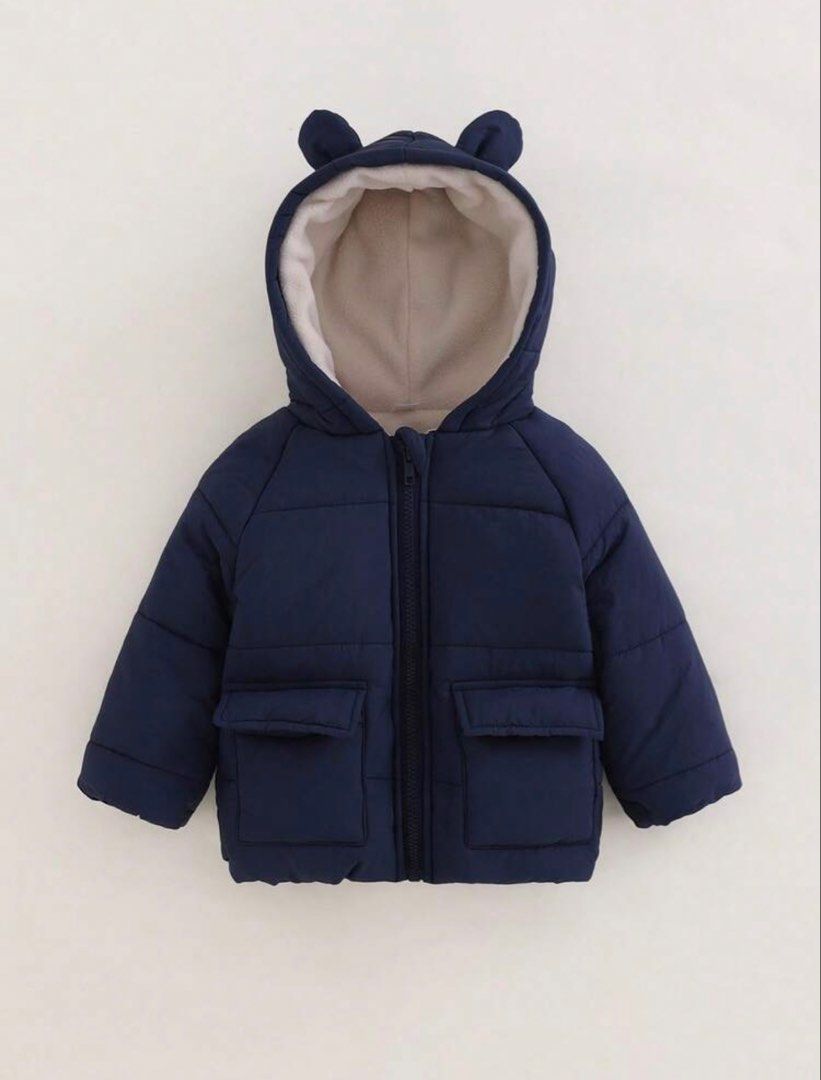 Navy Blue Puffer Jacket with Bear Ears Hood (Category: Babies & Kids Fashion) located in Quezon City. Submitted by issawoah (Listing ID 1463602656, Image 1). Description: - Adorable navy blue puffer jacket for kids - Cozy fleece lining inside the hood - Cute bear ears on the hood - Two functional front pockets - Easy zipper closure - Ideal for keeping warm on chilly days - 12 to 18 months on tag - Washed but never used.
