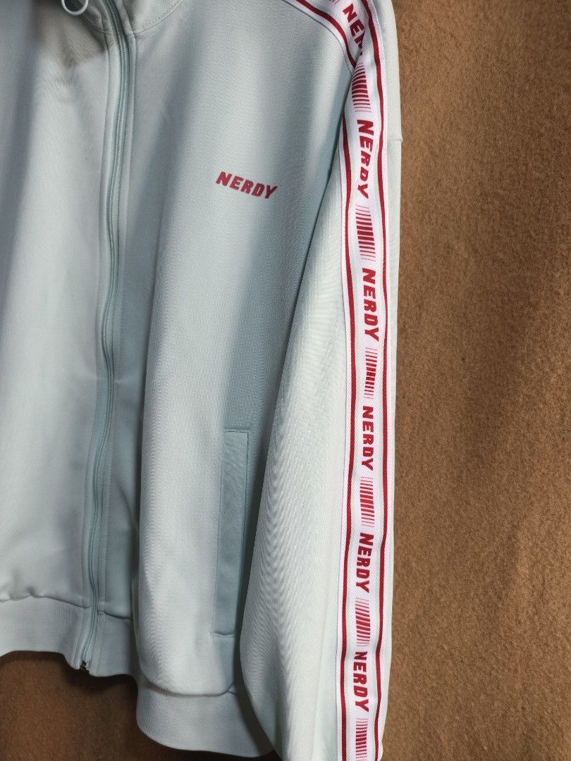 NERDY Logo Tape Track jacket (Category: Activewear) located in Camalaniugan. Submitted by thrifter10 (Listing ID 1463602997, Image 3). Description: jacket 24" x 27" pants size 30 to 34 lenght 40" leg opening 8.5".