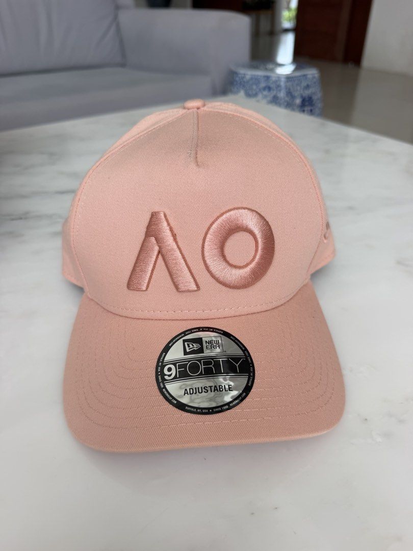 New Era 9FORTY Australian Open Blush Cap (Category: Caps & Hats) located in Lipa City. Submitted by pauline0303 (Listing ID 1463665590, Image 1). Description: - Brand New Era 9FORTY Cap - Color: Blush Pink - Features embroidered Australian Open 'AO' logo - Adjustable strap for a comfortable fit - Material: 100% Cotton - Ideal for sunny weather or adding to your collection.