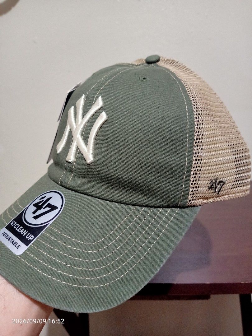 New York Yankees NY Trucker Cap (Category: Caps & Hats) located in Las Pinas. Submitted by OmengSoyT (Listing ID 1463686135, Image 3). Description: -Authentic New York Yankees trucker Cap -Olive green/Tan color - Iconic 'NY' logo embroidered on the front - Mesh back panel for breathability - Adjustable strap for a comfortable fit - 47' Clean Up style -Brandnew.Complete stickers and tags.