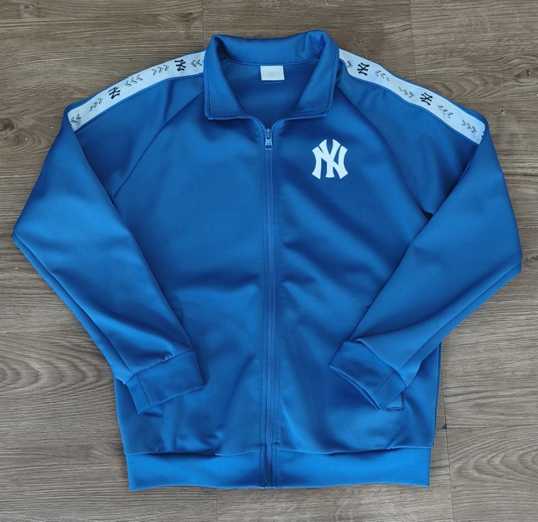 New York Yankees Track Jacket Blue (Category: Coats, Jackets and Outerwear) located in Manila. Submitted by aye_posadas (Listing ID 1463681889, Image 1). Description: - Blue New York Yankees track jacket - Full zip closure - White patterned tape detail on sleeves - Ribbed cuffs and hem - Ideal for casual wear or sports activities.
