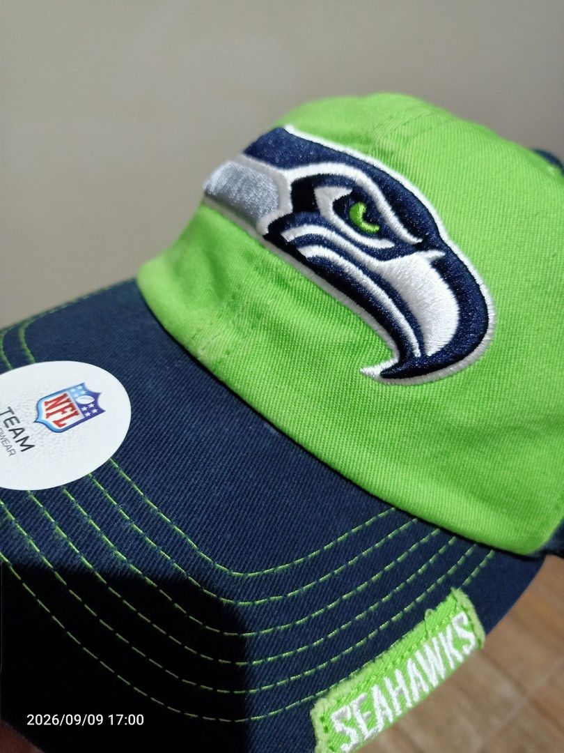 NFL Seattle Seahawks Team Apparel Cap (Category: Caps & Hats) located in Las Pinas. Submitted by OmengSoyT (Listing ID 1463703813, Image 1). Description: - Authentic Seattle Seahawks NFL cap - Embroidered team logo on front - Navy blue and lime green colorway - NFL Team Apparel tag attached -Brandnew - One size fits most.Adjustable - Perfect for Seahawks fans.