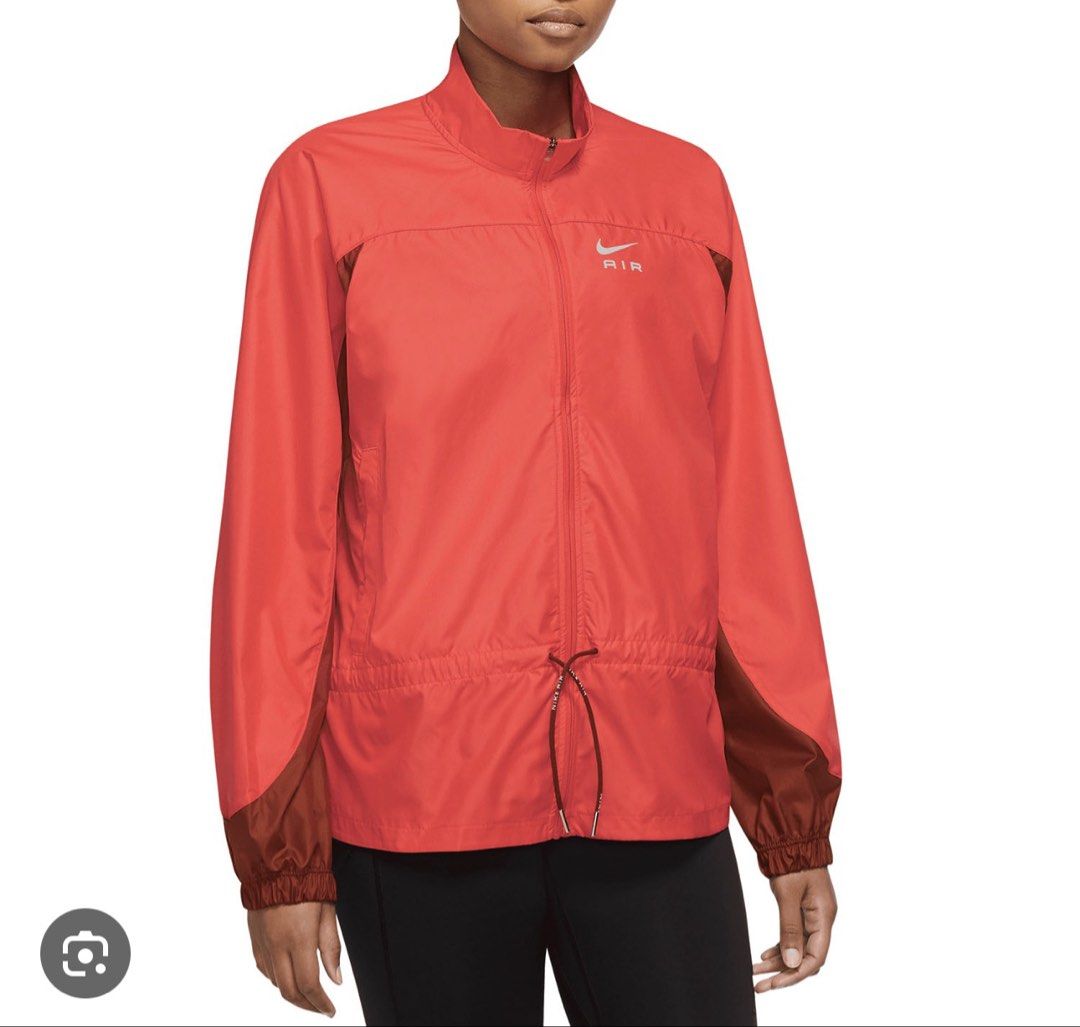 Nike Air Red Lightweight Running Jacket (Category: Coats, Jackets and Outerwear) located in Marikina City. Submitted by pborj (Listing ID 1463557943, Image 1). Description: - Red Nike Air jacket - Lightweight material, ideal for running or casual wear - Adjustable drawstring at the waist for a customized fit - Prominent Nike Air logo on both front and back - Stylish two-tone sleeves and panels - last photo for actual when worn.