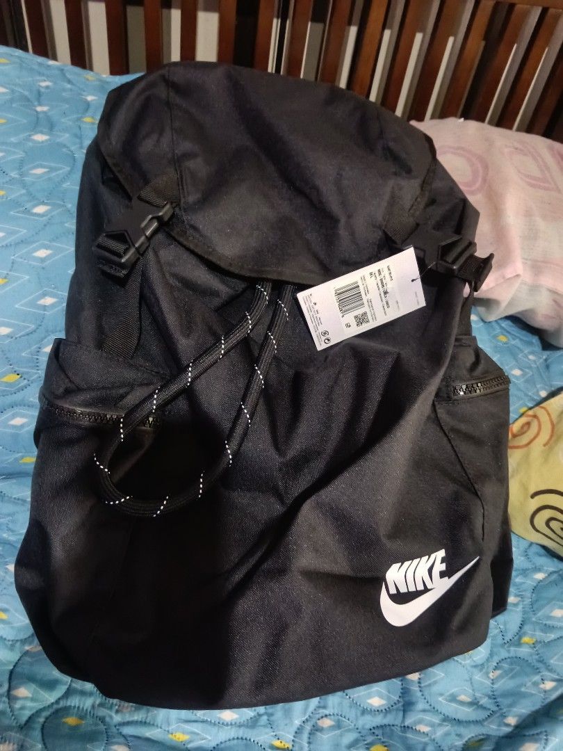 Nike Backpack (Category: Backpacks) located in Quezon City. Submitted by bshoppe_ (Listing ID 1463630860, Image 2). Description: - Brand new black Nike backpack - Secure drawstring closure with buckle flap - Multiple front and side pockets for organization - Ideal for school, gym, or everyday carry - Comes with original tags - 24 ltrs.