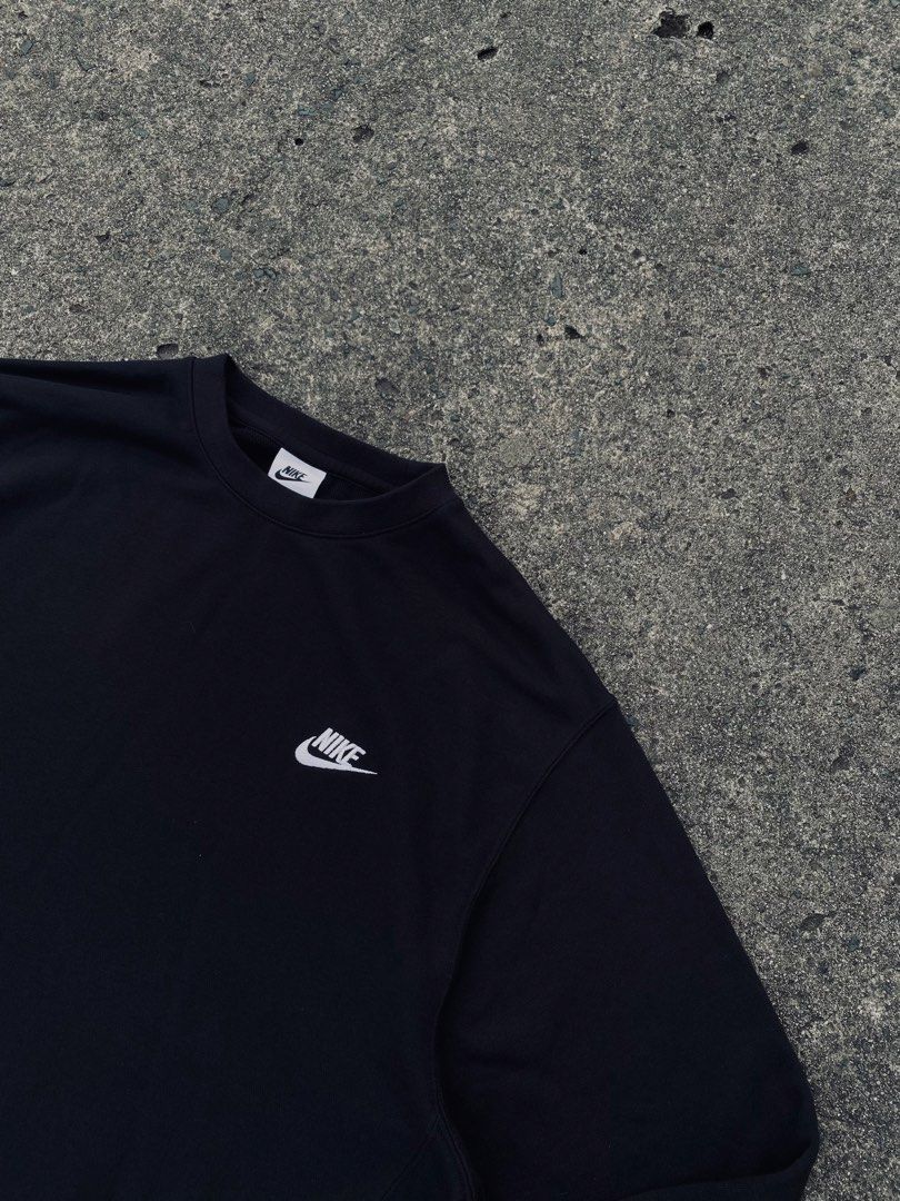 Nike Black Crewneck Sweatshirt (Category: Coats, Jackets and Outerwear) located in San Jose del Monte. Submitted by kidfromnclb (Listing ID 1463726393, Image 3). Description: - Classic black Nike crewneck sweatshirt - Iconic embroidered Nike swoosh logo on chest - Comfortable and versatile for everyday wear - Perfect for layering or wearing solo - Easily pairs with jeans or joggers - Essential wardrobe staple.