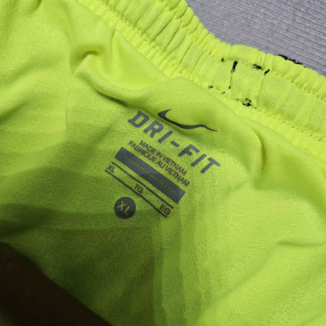 Nike Drifir Neon blacK Shorts (Category: Shorts) located in Baguio. Submitted by kayeonlineshop (Listing ID 1463619309, Image 2). Description: black Nike Dri-FIT athletic shorts featuring neon green side panels and a white Swoosh logo on the leg W28-36 L 19 h26.