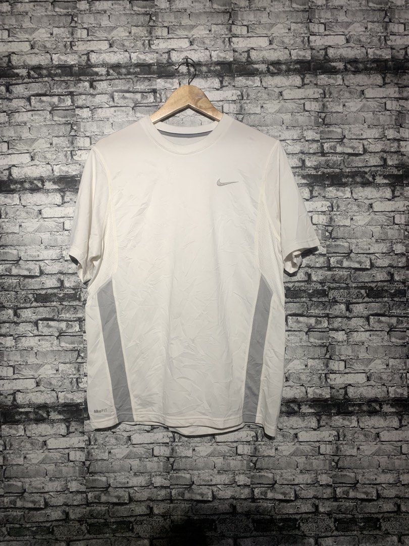 Nike Dri-FIT White Running T-Shirt (Category: Activewear) located in Manila. Submitted by marksaban81396 (Listing ID 1463673612, Image 1). Description: NIKE DRIFIT FOR RUNNING SIZE MEDUIM WIDTH 20 LENGHT 27 Color rate 9.5/10 No issue Excellent condition - White Nike Dri-FIT T-Shirt - Ideal for running and workouts - Breathable fabric for comfort - Stylish grey paneling on the sides - Classic Nike logo on the chest - Versatile for everyday active 