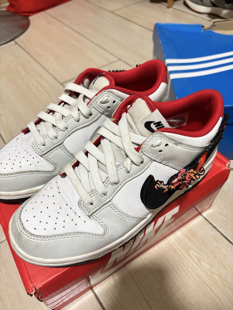 Nike Dunk Low Chinese New Year (Category: Sneakers) located in Manila. Submitted by keendeer.43add0 (Listing ID 1463660510, Image 1). Description: - Nike Dunk Lows - Classic White and Red colorway - Unique Dragon embroidery on the side - White laces - Check photos for detailed condition.