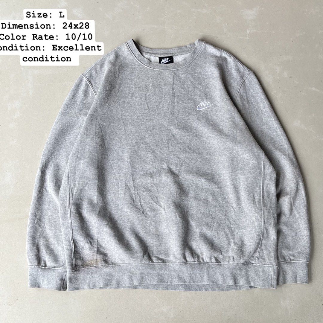 Nike Grey Crewneck Sweatshirt Size L (Category: Coats, Jackets and Outerwear) located in Mandaue City. Submitted by chinsyap_03 (Listing ID 1463652426, Image 1). Description: - Grey Nike crewneck sweatshirt - Size: Large (L) - Small Nike logo on chest - Faint stain on lower front (as pictured) - Comfortable and classic style.