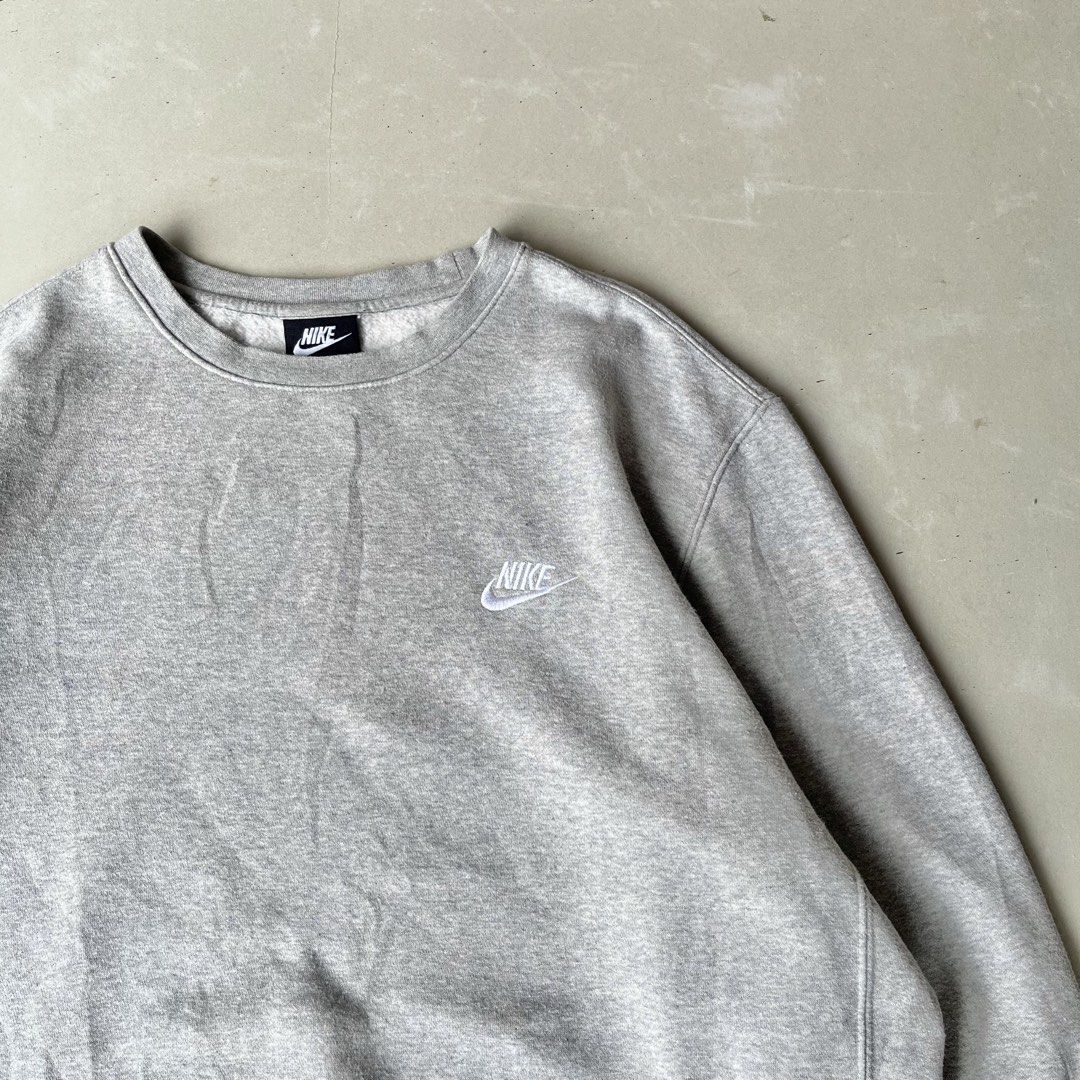 Nike Grey Crewneck Sweatshirt Size L (Category: Coats, Jackets and Outerwear) located in Mandaue City. Submitted by chinsyap_03 (Listing ID 1463652426, Image 3). Description: - Grey Nike crewneck sweatshirt - Size: Large (L) - Small Nike logo on chest - Faint stain on lower front (as pictured) - Comfortable and classic style.