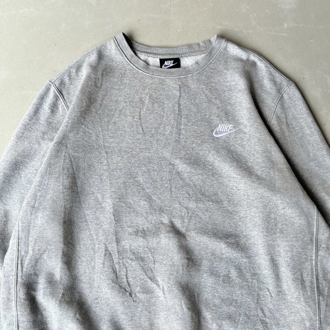 Nike Grey Crewneck Sweatshirt Size L (Category: Coats, Jackets and Outerwear) located in Mandaue City. Submitted by chinsyap_03 (Listing ID 1463652426, Image 2). Description: - Grey Nike crewneck sweatshirt - Size: Large (L) - Small Nike logo on chest - Faint stain on lower front (as pictured) - Comfortable and classic style.
