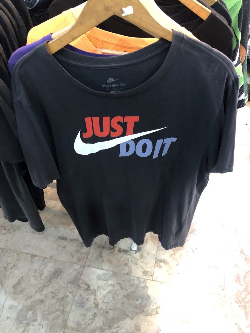 Nike Just Do It T-Shirt (Category: Shirts) located in Manila. Submitted by bakithrift213 (Listing ID 1463635059, Image 1). Description: - Classic black Nike t-shirt - Features iconic 'Just Do It' slogan and swoosh - Made from comfortable fabric - Ideal for casual wear or workouts - Highly versatile and easy to pair with any outfit.