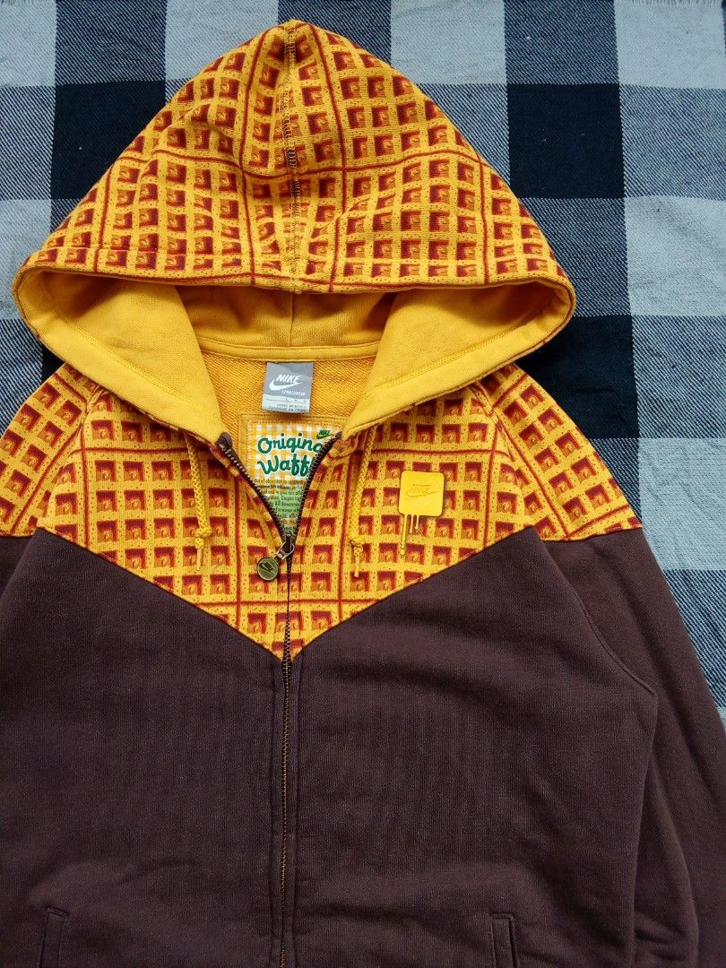 Nike Original Waffles Zip-Up Hoodie (Category: Coats, Jackets and Outerwear) located in Polomolok. Submitted by timog_high_ice_v2 (Listing ID 1463610476, Image 2). Description: - Super cool Nike hoodie - Size Large on tag - Width 18 - Length 24 - Fun yellow and brown waffle print - Full zip-up front with pockets - Waffle pattern on hood and upper chest - "Original Waffles" graphic inside - "Waffle" detail on sleeve cuff - Great for casual wear So
