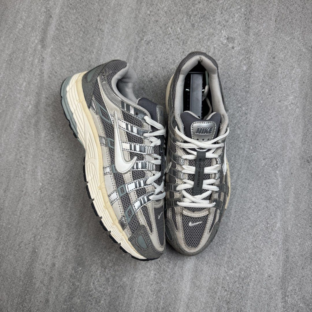 Nike P-6000 Metallic Silver Grey Running Shoes (Category: Sneakers) located in Manolo Fortich. Submitted by thrift_by_biji (Listing ID 1463688565, Image 1). Description: - Nike P-6000 Sneakers - Color: Metallic Silver & Grey - Classic running shoe design - Comfortable for everyday wear - Stylish and versatile.