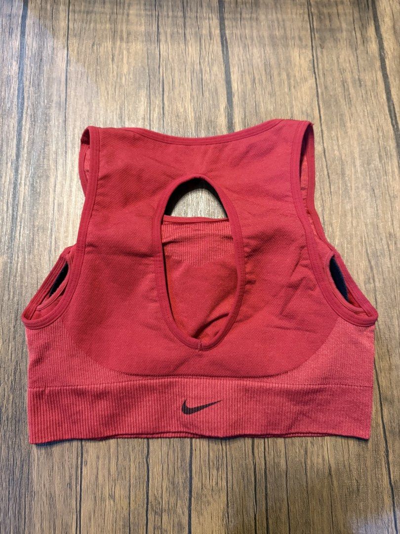 Nike Red Sports Bra MEDIUM 3for1K (Category: Activewear) located in Makati City. Submitted by lucy_dec (Listing ID 1463661376, Image 2). Description: - Red Nike sports bra - Seamless design for ultimate comfort - Chic cutout detail at the back - Ribbed band at the bottom provides excellent support - Features the classic Nike logo on the back band - Ideal for workouts, gym sessions, or everyday casual wear RFS: decluttering.