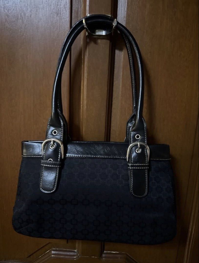 Nine West Black Monogram Shoulder Bag (Category: Shoulder Bags) located in Pasig City. Submitted by aprilluxcloset0812 (Listing ID 1463687749, Image 2). Description: - Brand: Nine West - Color: Black - Style: Shoulder Bag - Design: Subtle all-over geometric pattern - Details: Two front buckle accents - Material: Leather handles and trim - Interior: One zip pocket - Size: Ideal for daily essentials RFS: decluttering EVERYTHING MUST GO‼️Just make a