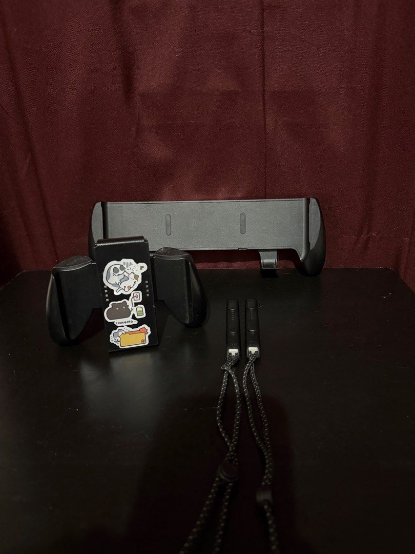 Nintendo Switch Accessories (Category: Other Mobile & Gadget Accessories) located in Caloocan City. Submitted by rohllee (Listing ID 1463559163, Image 2). Description: Nintendo Switch Accessories OLED Grip - 400 Controller Grip - 400 Wrist Straps - 150 Take all for 800.