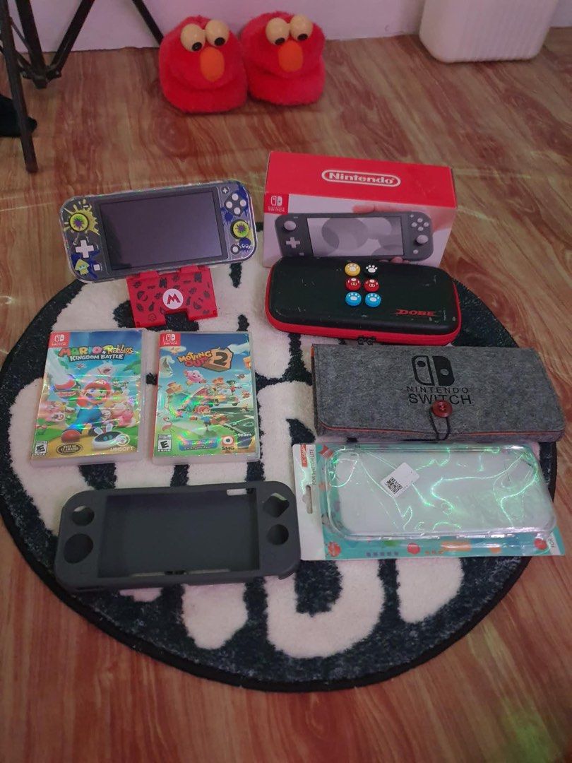 Nintendo Switch Lite (Category: Nintendo) located in Naic. Submitted by warmflower.09bd07 (Listing ID 1463258512, Image 1). Description: - Nintendo Switch Lite console (Gray) - No history of repair, not JB, greatcondition - Tempered Glass Installed - No Joycon Drift - Great Battery Life - Include 128GB SD Card - Include Original Nintendo Switch Cable Cord - Include 2 Cartridge Games Bago pa - Include 3 Case, 2 Pouch, 3 Pairs Of Silicone Thumb Gri