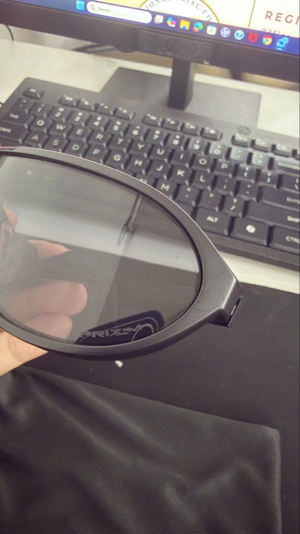Oakley Sunglasses with Pouch (Category: Sunglasses & Eyewear) located in Naic. Submitted by joancust (Listing ID 1463578099, Image 2). Description: - Brand: Oakley - Frame Color: Black - Lens Color: Dark - Includes: Black pouch.