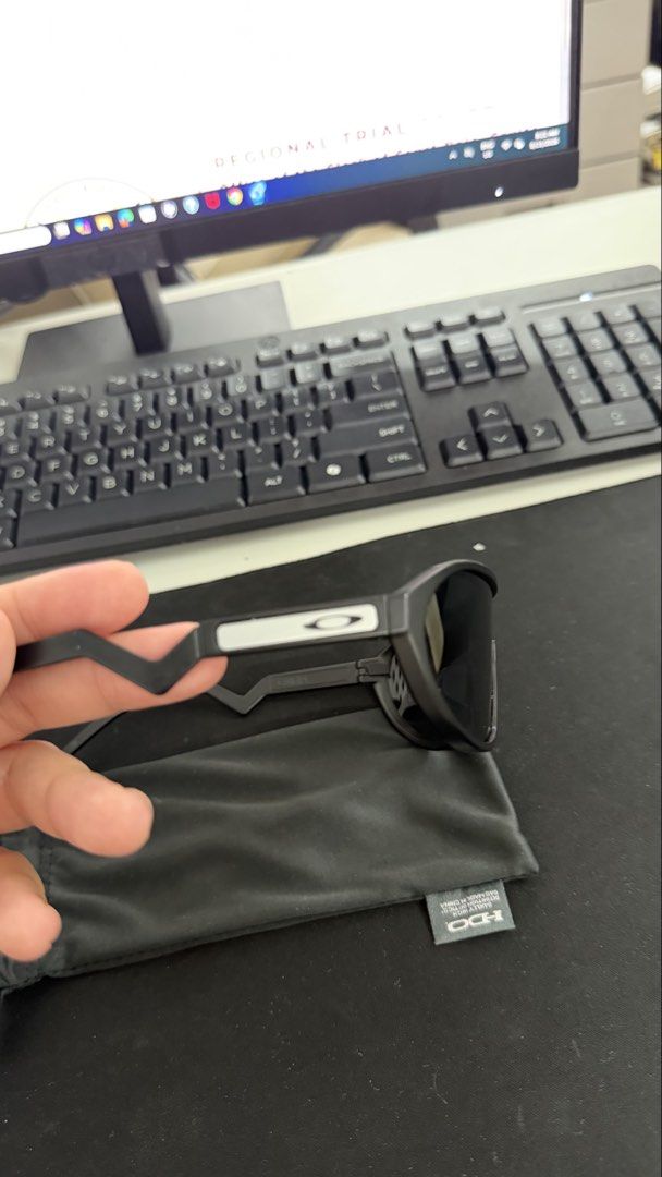 Oakley Sunglasses with Pouch (Category: Sunglasses & Eyewear) located in Naic. Submitted by joancust (Listing ID 1463578099, Image 3). Description: - Brand: Oakley - Frame Color: Black - Lens Color: Dark - Includes: Black pouch.