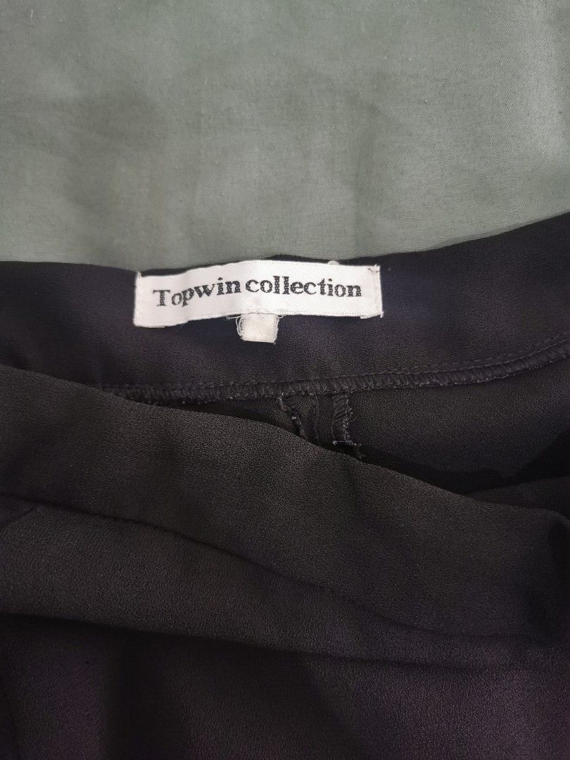 Office black skirt (Category: Skirts) located in Paranaque City. Submitted by clarizas.closet (Listing ID 1463690352, Image 3). Description: Topwin Collection Black Skirt with Button and Side Zip Fits s to m.