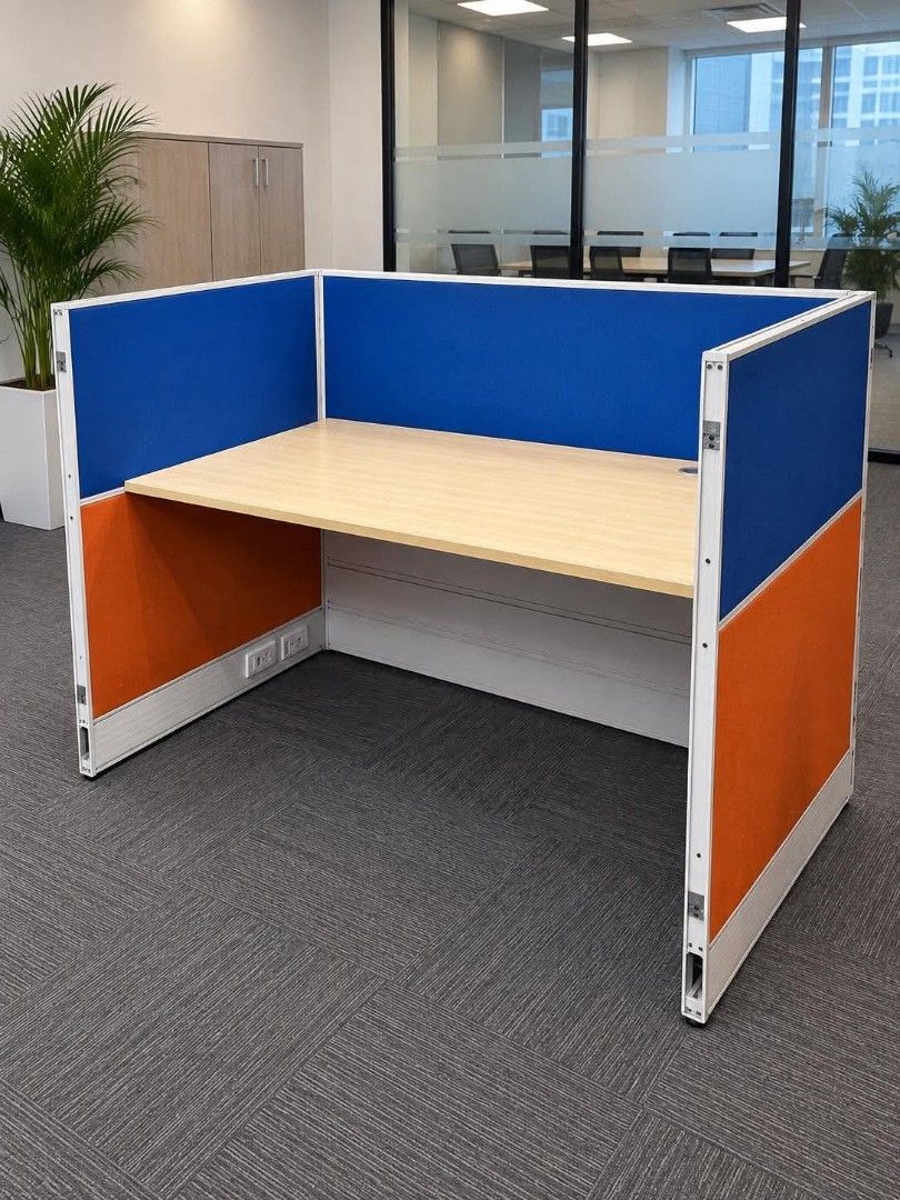 Office Cubicle Workstation with Blue and Orange Panels (Category: Office Furniture & Fixtures) located in Quezon City. Submitted by kcofficefurnitures (Listing ID 1463710924, Image 1). Description: 🪑 OFFICE WORKSTATION / CUBICLE – FOR SALE Preloved Office Workstation with Partition ✔️ Complete workstation setup ✔️ Spacious desk/tabletop ✔️ Built-in side partitions ✔️ Blue & orange fabric/accent panels ✔️ With cable management opening ✔️ Durable 
