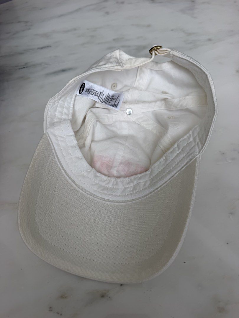 Old Navy California White Baseball Cap (Category: Babies & Kids Fashion) located in Lipa City. Submitted by pauline0303 (Listing ID 1463666406, Image 2). Description: - White Old Navy cap - Salmon Pink 'Old Navy California' embroidery on the front - Adjustable strap with a gold buckle at the back - Ideal for sunny days - Classic and simple style.