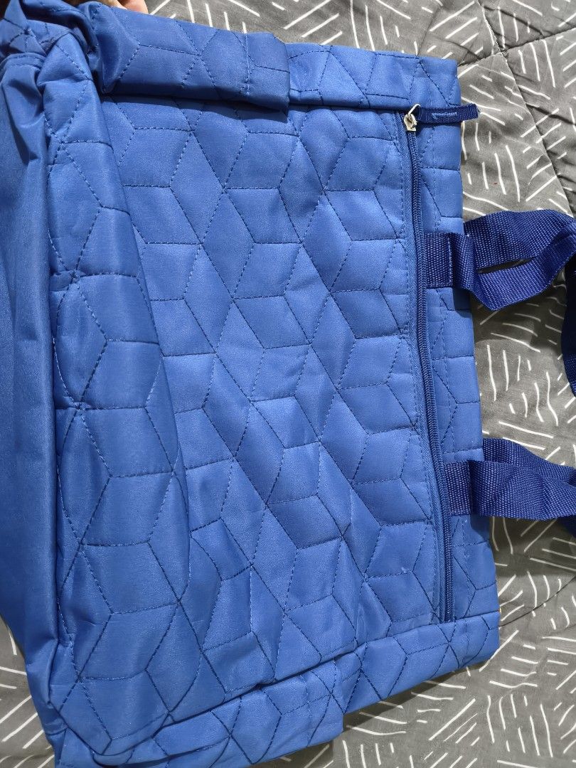 Ollin Blue Quilted Tote Bag (Category: Diaper Bags & Wetbags) located in Tarlac. Submitted by momma02 (Listing ID 1463636567, Image 2). Description: - Blue quilted tote bag from Ollin - All-over geometric pattern - Two zippered front pockets - Two side pockets - One zippered back pocket - Blue fabric handles - Ideal for everyday use or travel -very spacious -used only a few times, looks new -slightly nego. pls send your reasonable offer🩵.