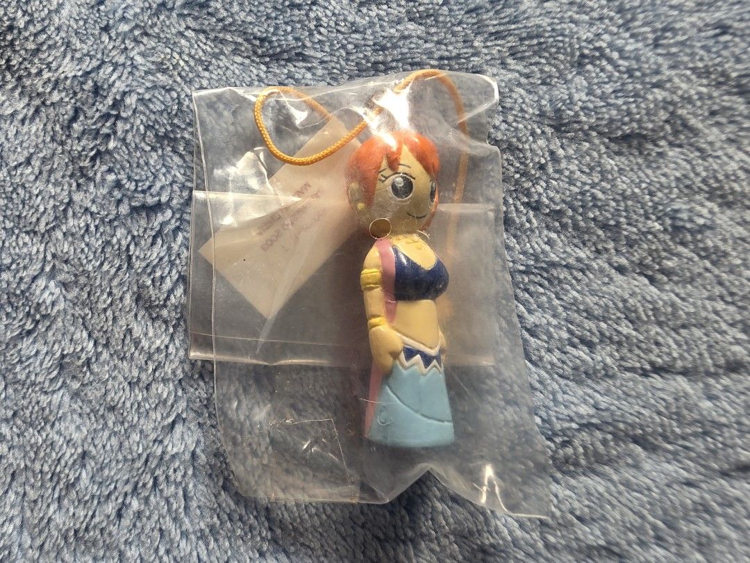 One Piece Nami Wooden Doll Keychain (Category: Other Merchandise) located in Manila. Submitted by animestuffsshop (Listing ID 1463664090, Image 1). Description: One Piece Nami Wooden Doll Keychain - Official - WYSIWYG MOD: JNT, LBC COP, Lalamove MOP: GCASH.