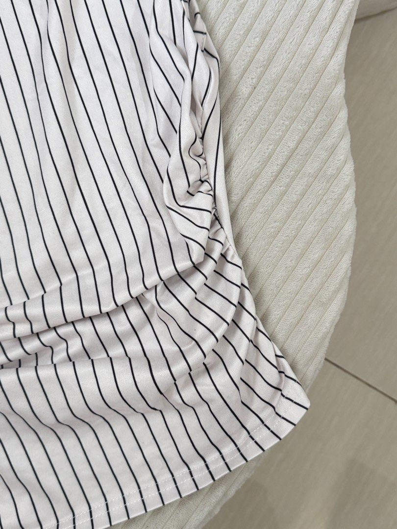 One Shoulder Striped Top (Category: Sleeveless) located in Dasmarinas. Submitted by ella.i2 (Listing ID 1463635636, Image 3). Description: - Never used - White top with black pinstripes - One-shoulder design - Ruched detailing on the side - Stretchy material for a comfortable fit - Versatile for casual day or night out 📍Dasma.