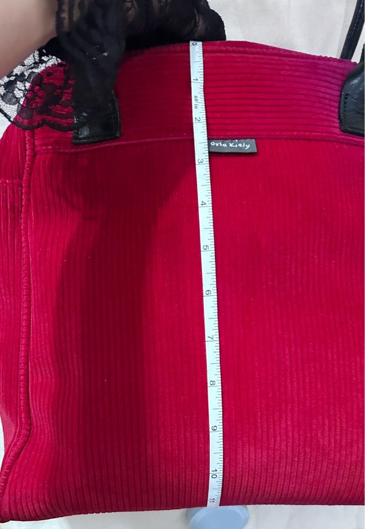 Orla Keily Red Bag (Category: Shoulder Bags) located in Makati City. Submitted by cestparfaitvintagejewelries (Listing ID 1463657360, Image 3). Description: Flaw:The back part has a small stain, and the handle has some cracks, but overall it’s still in good condition. .