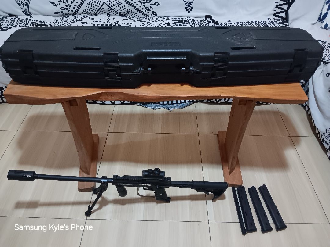 Paintball Set (Category: Other Sports Equipment and Supplies) located in Caloocan City. Submitted by 01111011 (Listing ID 1463683118, Image 1). Description: This is a milsim paintball marker, NOT a weapon! Tippmann 98 Custom with: - 1 standard barrel - 1 straight-bored long barrel - 1 Apex tip/ramp (for trick shots) - 1 expandable stock - 1 bipod - 3 20-round ZetaMags (10 rounds x 2 sides) - 1 red dot sight - 5 variable springs (used to change th
