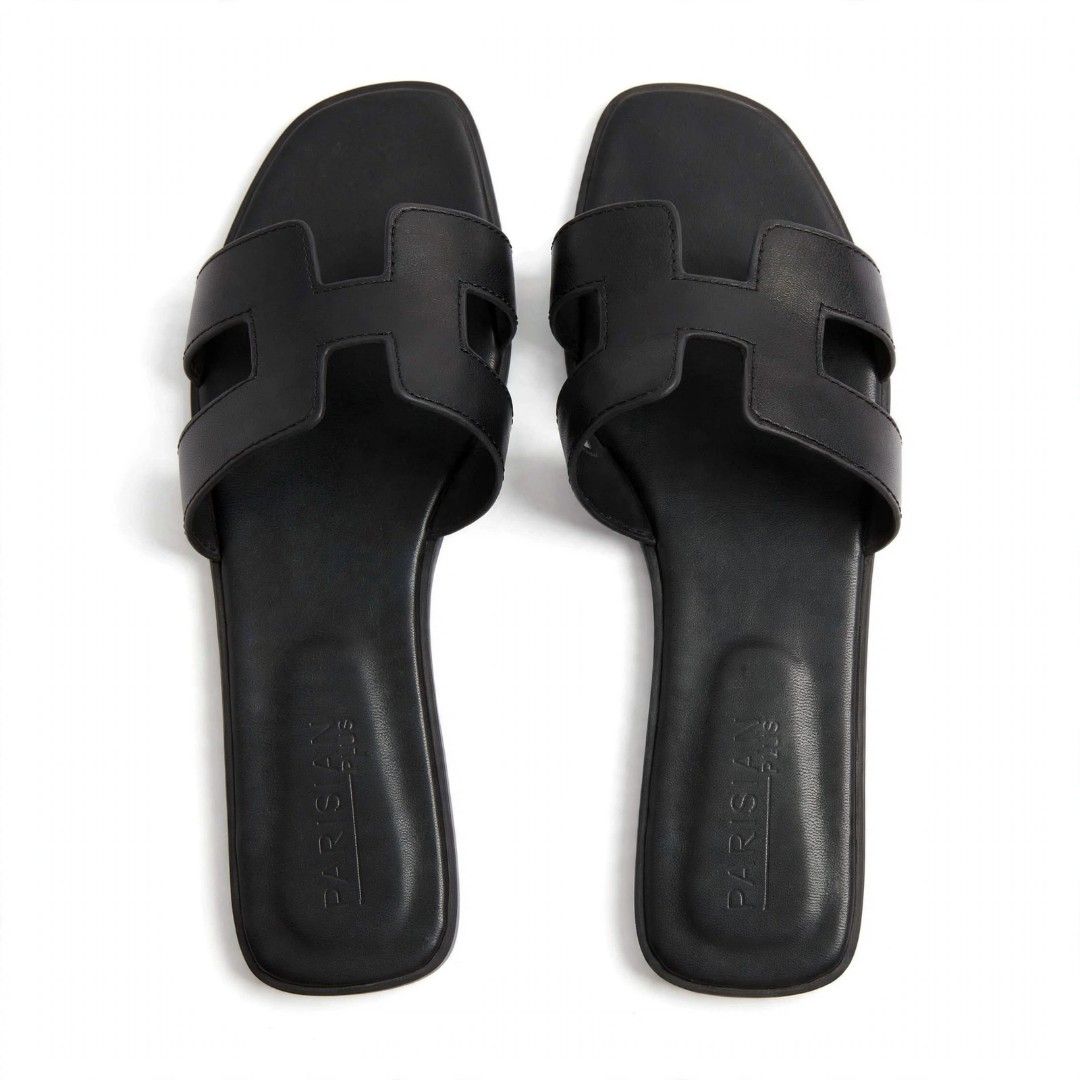 PARISIAN PLUS Black H-Strap Slides (Category: Flats & Sandals) located in Manila. Submitted by roseannlmn66895 (Listing ID 1463739301, Image 1). Description: *Parisian Plus H Flat Slides - Size 41 - Like New* Size 41 (Plus Size 9-10 US) Brand: Parisian Plus - Black Cond: Preloved Like New, once used, no issue / no bakbak Orig: ₱699 sa SM Sell: ₱399 only Loc: Manggahan Pasig - Lalamove / Grab.