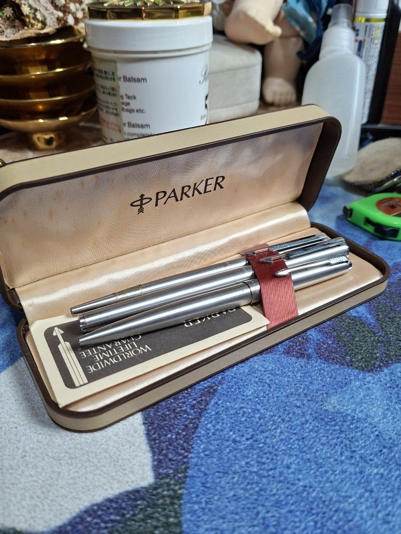 Parker Pen Set with Case and Guarantee (Category: Stationery & School Supplies) located in Lucena. Submitted by dai_suki (Listing ID 1463696106, Image 1). Description: - Vintage Parker pen set - Original case included - Set includes two pens,mechanical pencil and mechanical pencil - Comes with worldwide lifetime guarantee cards - Pens are brushed metal - Case: classic brown exterior with cream interior - Ideal for collectors or everyday use.