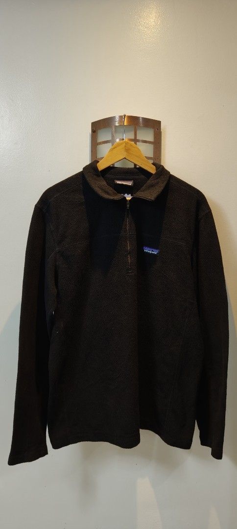 Patagonia Black Fleece 1/4 Zip Pullover (Category: Coats, Jackets and Outerwear) located in Bulacan. Submitted by adrian2325 (Listing ID 1463720960, Image 3). Description: - Classic black Patagonia fleece pullover - Quarter-zip neckline - Iconic Patagonia logo on chest - Soft and warm material, ideal for layering - Long sleeves with elasticated cuffs - Versatile for outdoor activities or casual wear.