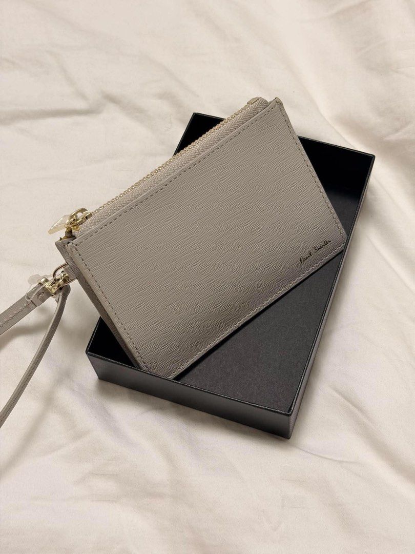 Paul Smith Cardholder with Wrist Strap (Category: Wallets & Card Holders) located in Quezon City. Submitted by NiniTheExplorer (Listing ID 1463681607, Image 2). Description: Paul Smith wrist strap wallet Light Gray Genuine cow leather approximately 12 × 8–8.5 × 1.5 cm Comes with original box, dust bag, and card ₱5,000.