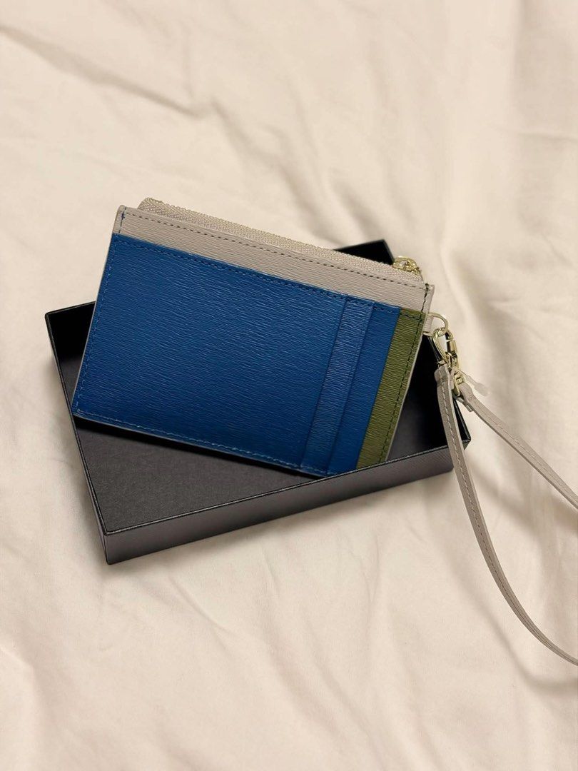 Paul Smith Cardholder with Wrist Strap (Category: Wallets & Card Holders) located in Quezon City. Submitted by NiniTheExplorer (Listing ID 1463681607, Image 3). Description: Paul Smith wrist strap wallet Light Gray Genuine cow leather approximately 12 × 8–8.5 × 1.5 cm Comes with original box, dust bag, and card ₱5,000.