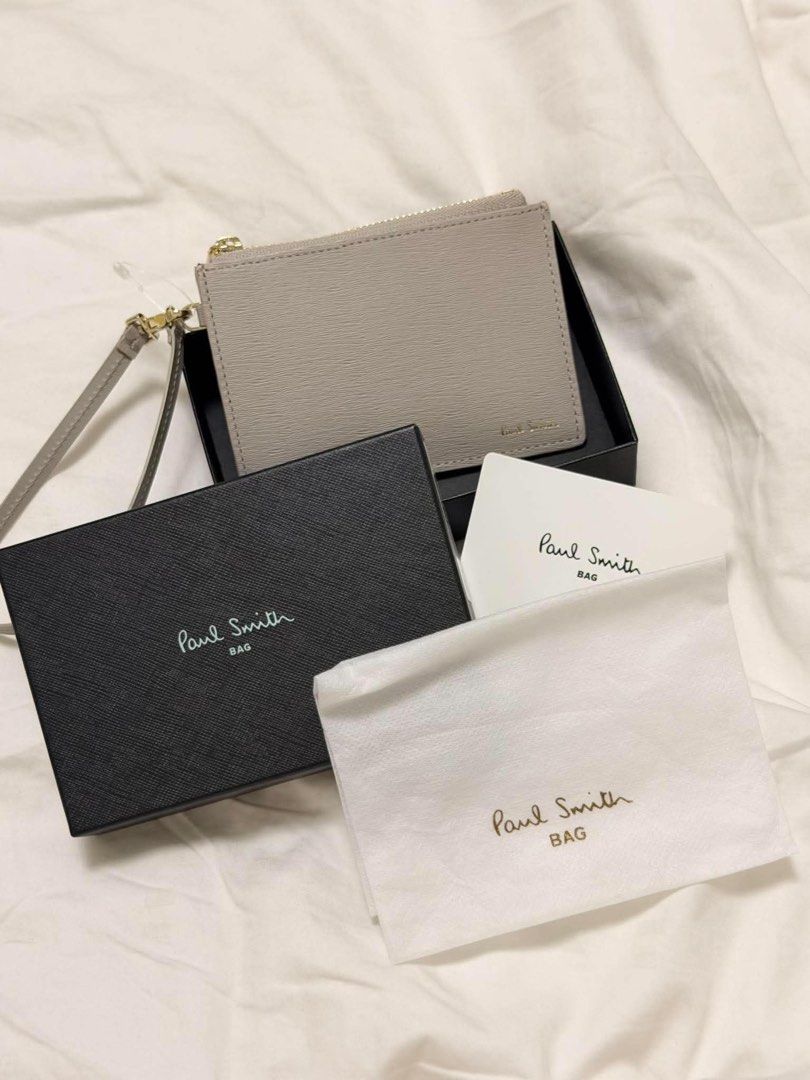 Paul Smith Cardholder with Wrist Strap (Category: Wallets & Card Holders) located in Quezon City. Submitted by NiniTheExplorer (Listing ID 1463681607, Image 1). Description: Paul Smith wrist strap wallet Light Gray Genuine cow leather approximately 12 × 8–8.5 × 1.5 cm Comes with original box, dust bag, and card ₱5,000.