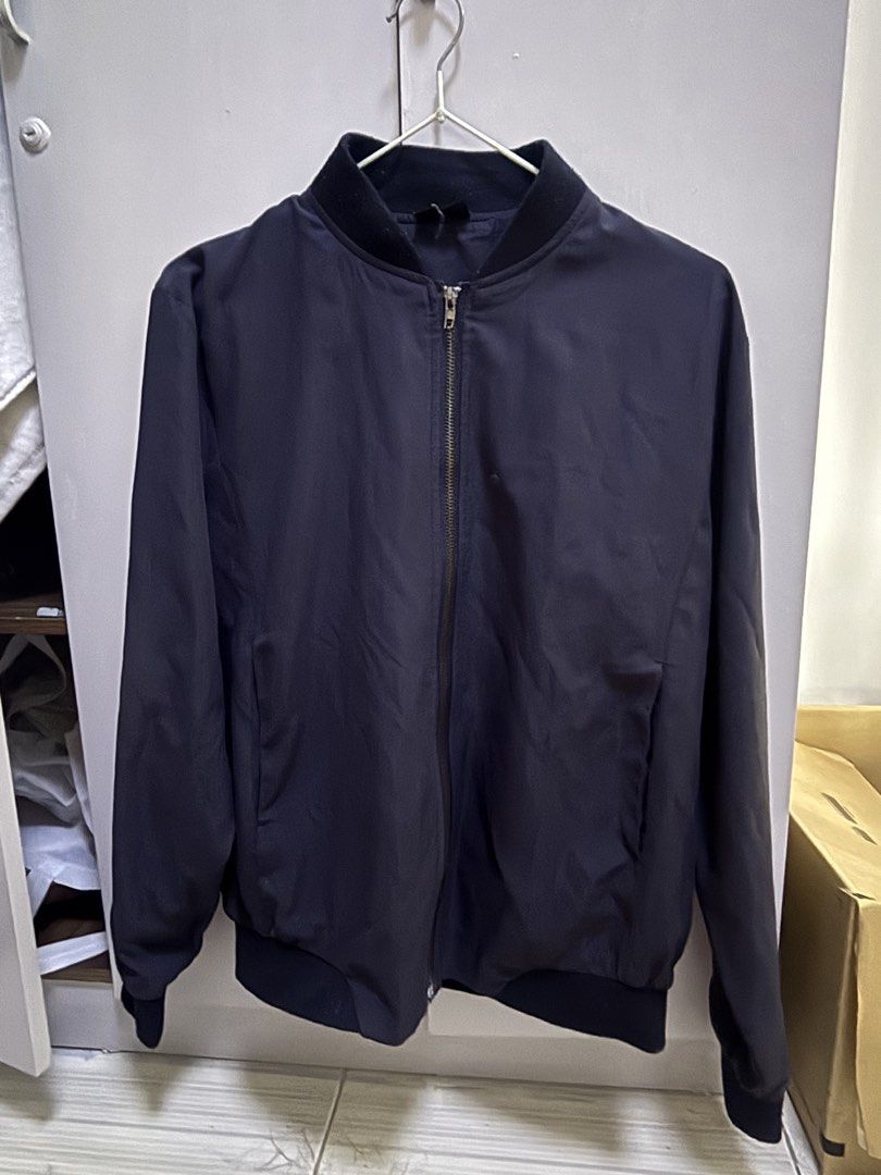 PENSHOPPE Navy Blue Bomber Jacket XS (Category: Coats, Jackets and Outerwear) located in Rizal. Submitted by gwen.gala (Listing ID 1463616585, Image 1). Description: - Navy blue PENSHOPPE bomber jacket - Size XS - Classic zip-up style - Ribbed collar, cuffs, and hem - Two side pockets - Versatile for layering or standalone wear - Ideal for casual outfits.