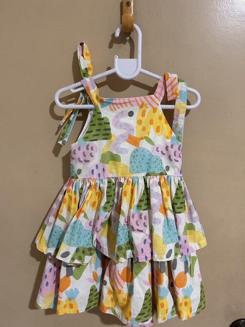 Peppermint Dress (Category: Babies & Kids Fashion) located in Bocaue. Submitted by ks_boutique (Listing ID 1463687166, Image 1). Description: - Adorable tiered dress for kids - Fun, colorful abstract print all over - Adjustable tie straps at the shoulders - Perfect for playtime or parties - Lightweight and comfortable fabric.