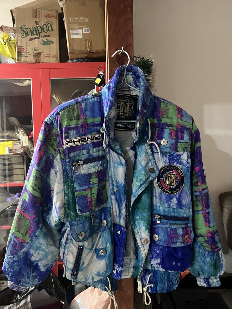 Phenix International Ski Federation Ski Jacket (Category: Coats, Jackets and Outerwear) located in Las Pinas. Submitted by porshuh (Listing ID 1463617410, Image 1). Description: Las Piñas Loc No issue, RFS decluttering - Vintage Phenix ski jacket - Features International Ski Federation (FIS) logo - Bold tie-dye pattern in blue, purple, and green - Multiple pockets for storage - Adjustable drawstring waist for a custom fit - Ideal for skiing or a 