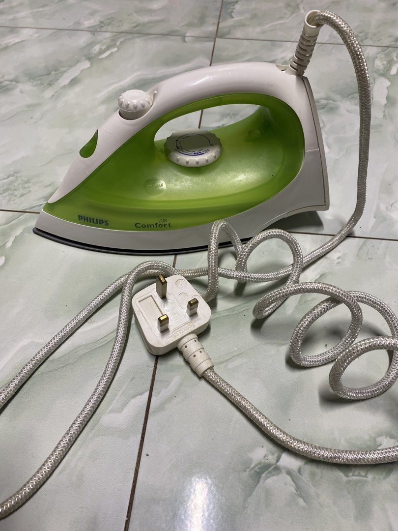 Philips Comfort 1000W Steam Iron (Category: Irons & Steamers) located in Pasacao. Submitted by wengpullar37205 (Listing ID 1463711863, Image 2). Description: - Philips Comfort 1000W Steam Iron - Color: White and Green - Powerful steam function for wrinkle removal - Includes power cord and plug - Tested and confirmed working.