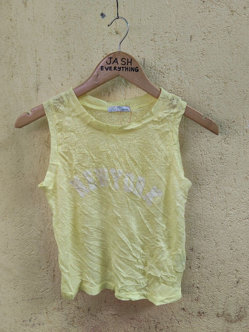 Philtér Yellow Sleeveless Graphic Top (Category: Sleeveless) located in City of Isabela. Submitted by jasheverything (Listing ID 1463566404, Image 1). Description: - Yellow sleeveless top from Philtér - Features a graphic print on the front - Made from lightweight knit material - Ideal for casual wear - Versatile: pairs well with shorts or jeans Xs to S Excellent Condition 400+SF.