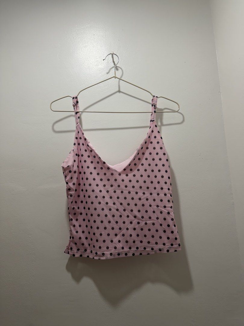 Pink Polka Dot Cami Tank Top (Category: Sleeveless) located in Rizal. Submitted by renee.ann (Listing ID 1463660254, Image 1). Description: - bought it for ₱350 - Cute pink cami tank top - Features black polka dots - Adjustable straps for a perfect fit - Lightweight and comfortable material - Versatile for layering or wearing on its own - Pairs well with jeans or shorts.