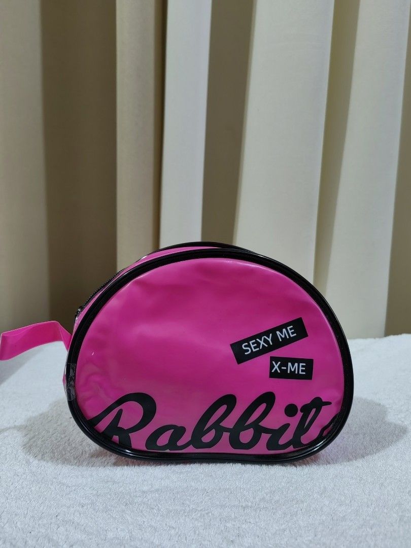 Pink Rabbit Cosmetic Bag (Category: Purses & Pouches) located in Makati City. Submitted by prelovedtreatedwithlove (Listing ID 1463739943, Image 1). Description: - Adorable pink cosmetic bag - Features 'Rabbit' and 'SEXY ME X-ME' text - Secure zipper closure - Ideal for storing makeup and small essentials - Compact and easy to carry - no issue .