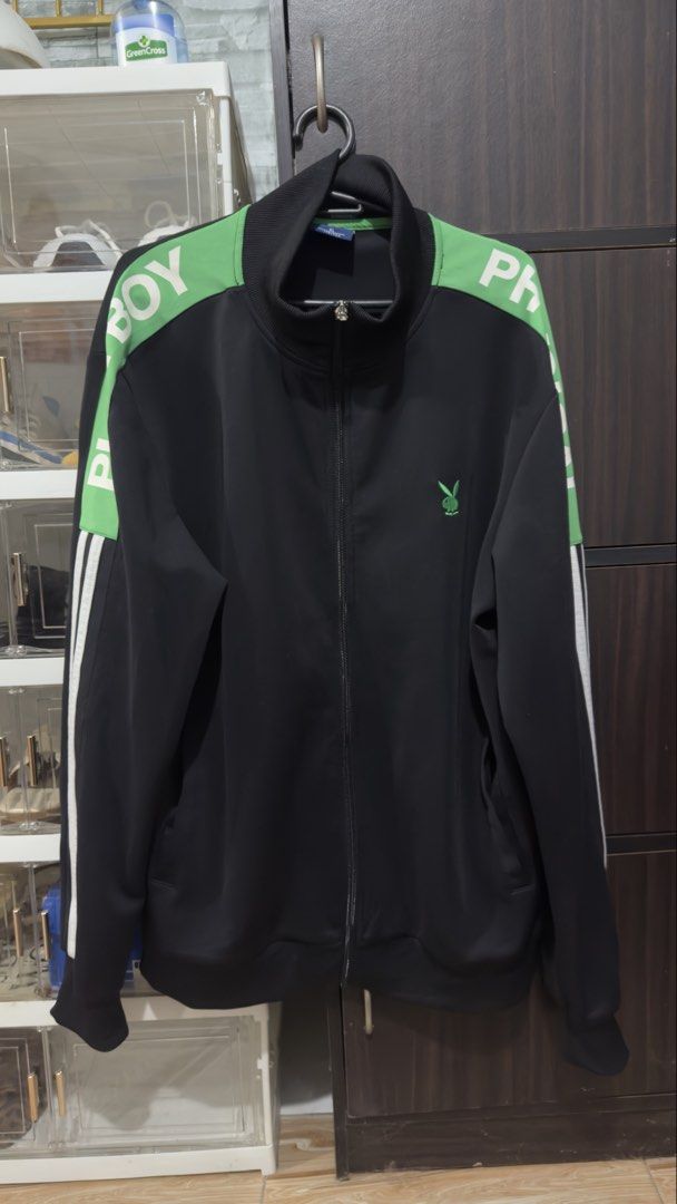 Playboy Black & Green Track Jacket XL (Category: Coats, Jackets and Outerwear) located in Bulacan. Submitted by jenelynichole (Listing ID 1463674017, Image 2). Description: - Playboy black track jacket - Size XL - Features green accents on shoulders and sleeves - Iconic Playboy bunny logo on chest - Full zip closure - Ribbed collar, cuffs, and hem for a comfortable fit.