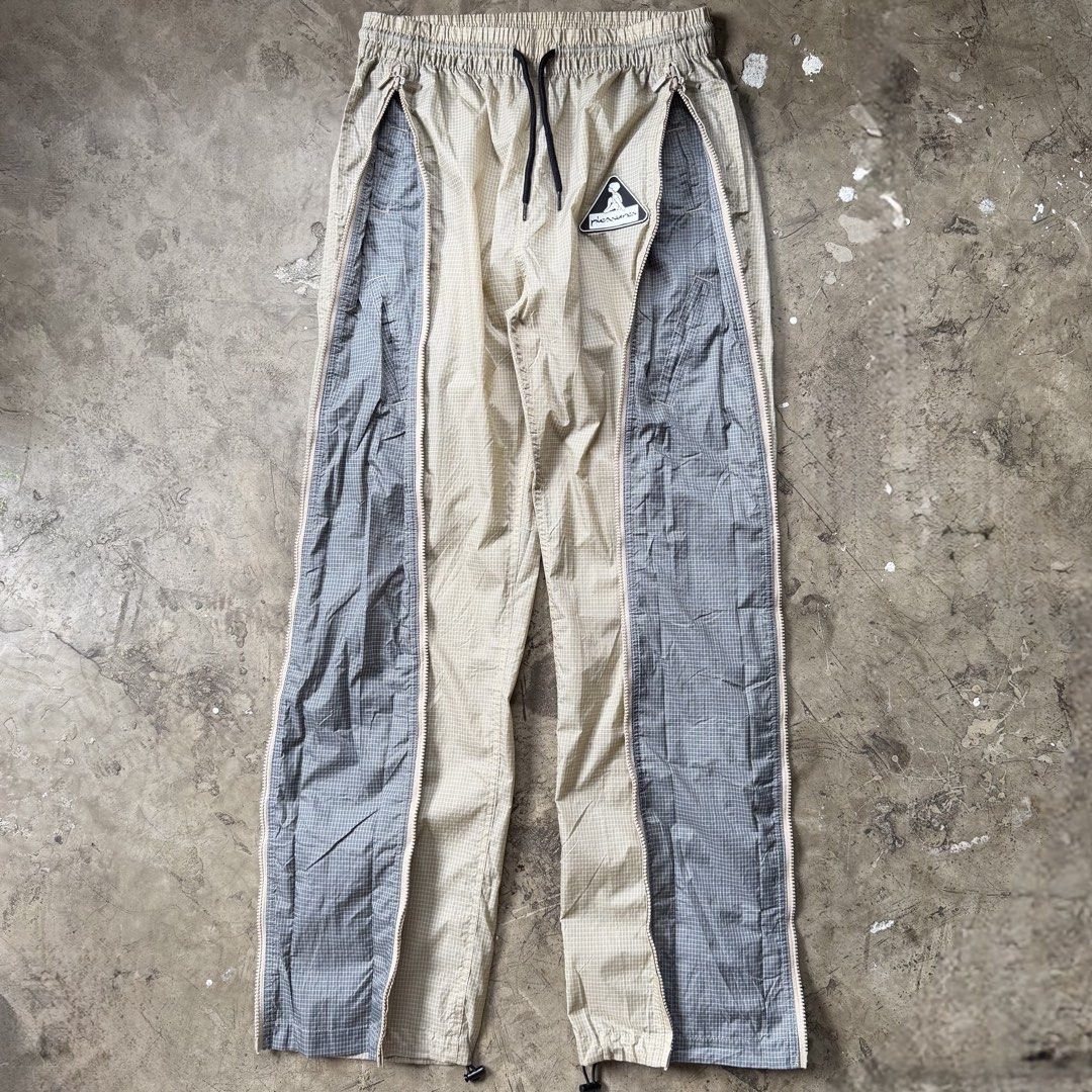 Pleasures - Brick Tech Track Pants (Category: Trousers) located in Cavite. Submitted by 4118.ph (Listing ID 1463657257, Image 2). Description: Medium 30-34 Excellent condition Waist 15” Length 43” Inseam 31” Leg opening 7”.